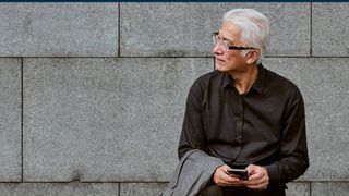 A whitepaper from ServiceNow on steps to a stronger security posture through automation, with image of businessman