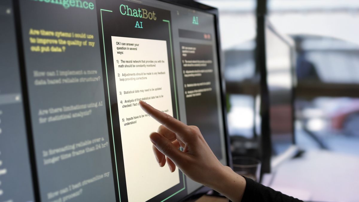 hand interacting with chatbot via a touchscreen