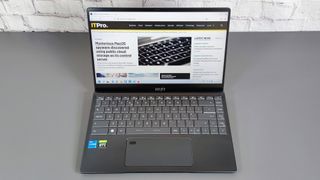 A photograph of the MSI Prestige 14 A12UC 2022 sat on a desk