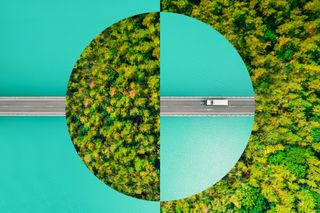 Sustainability concept art image featuring a vehicle driving on a road with forested area ahead