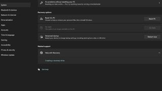 A screenshot of the Windows 11 Settings menu showing options for resetting a PC