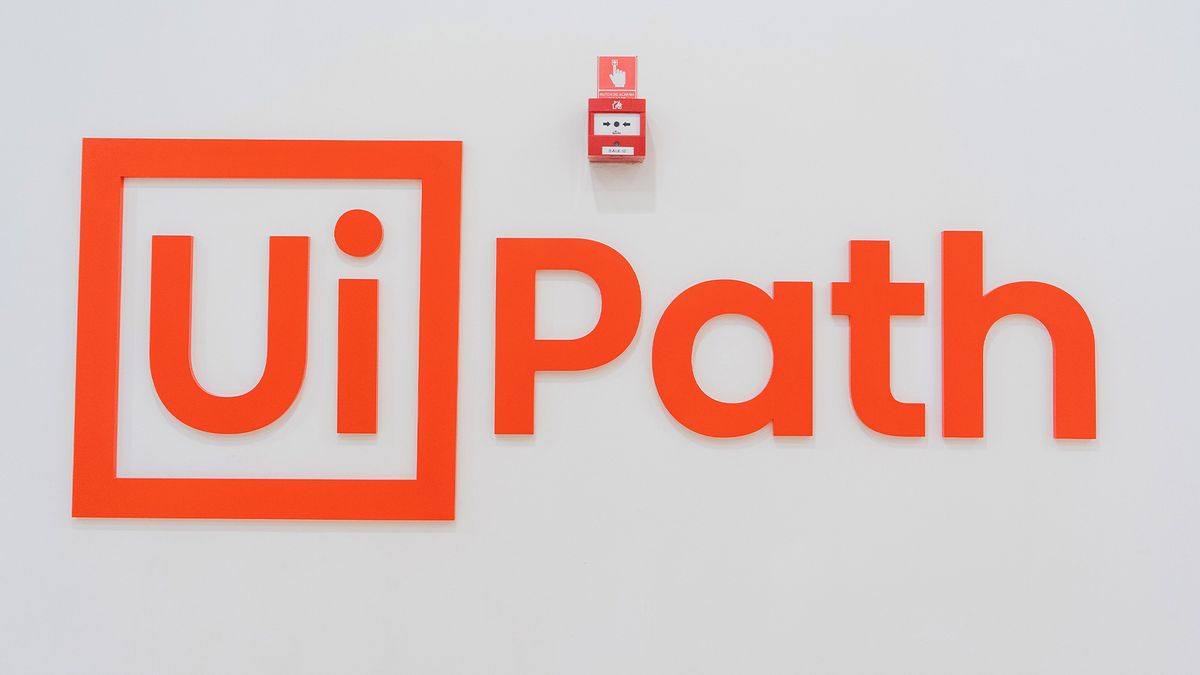 UiPath logo and branding pictured on a wall at the company&#039;s headquarters in Bucharest, Romania.