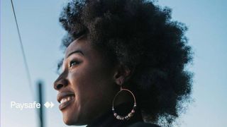Woman smiling and looking off into the horizon