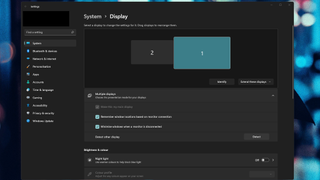 A screenshot of the Windows 11 Display Settings menu showing options for extending or rotating a connected display