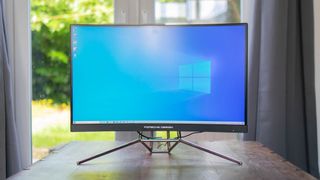 A photograph of the Porsche Design AOC Agon PD27 on a table