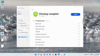 Screenshot of a PC utility app scanning for software issues on Windows 11