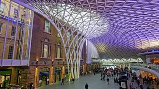 Interior of King's Cross train station in London. King's Cross is operated by Network Rail alongside several stations across London