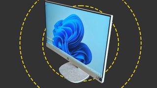 An image of the HP All-in-One 27 against a dark grey background with yellow concentric circles.