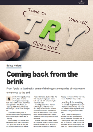 Hand underlining the word 'Reinvent' written underneath the word 'Try' in 3-d blocks