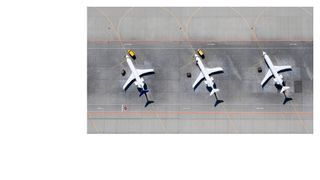 Birds-eye image of two planes on a run way