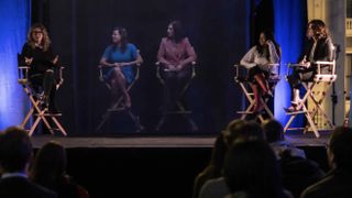 A lecture taking place with two virtual holographic participants