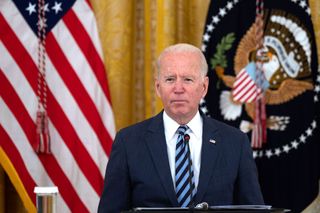 President Biden stood at a lectern in the White House