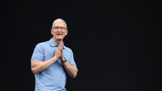 A telephoto picture of Tim Cook, speaking onstage against a pure black background at Apple Worldwide Developers Conference 2023.